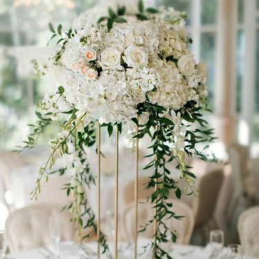 Via del Corso - Centerpieces of white hydrangea, roses, stock, spray roses and Italian ruscus
